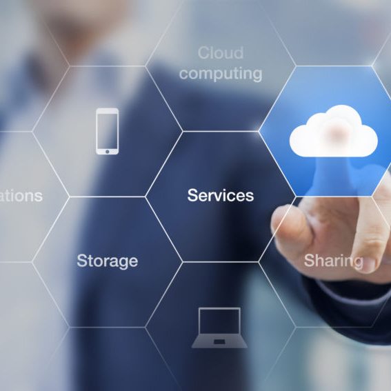 Concept about cloud computing, applications, storage, services online Concept about cloud computing, applications, storage, and services with a businessman touching a button on virtual screen